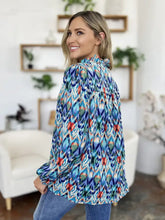 A vibrant long-sleeved blouse with bold geometric pattern in blue teal red and white double take full size printed balloon sleeve blouse