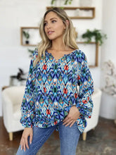 Double take full size printed balloon sleeve blouse with vibrant blue green and red ikat pattern and v-neckline