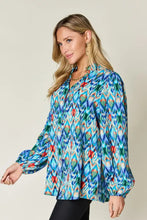 Double take full size printed balloon sleeve blouse with vibrant geometric ikat pattern in blue green and red
