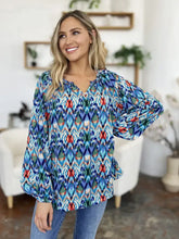 Double take full size printed balloon sleeve blouse in vibrant blue red and green ikat pattern with v-neckline and puffy sleeves