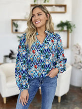 Double Take full size printed balloon sleeve blouse in vibrant blue and red geometric pattern with long sleeves