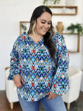 Double Take full size printed balloon sleeve blouse with vibrant blue red and green ikat pattern and v-neckline