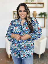Double take full size printed balloon sleeve blouse featuring vibrant blue red and green ikat pattern with button-down front