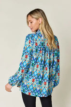 Double take full size printed balloon sleeve blouse in vibrant blue green and red ikat pattern with long sleeves