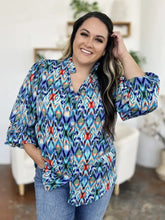 Double take full size printed balloon sleeve blouse in vibrant blue green and red ikat pattern with ruffled sleeves