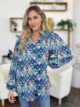 A vibrant blue red and teal ikat patterned double take full size printed balloon sleeve blouse with v-neckline