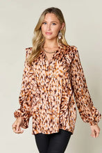 Women’s long-sleeved blouse with brown beige leopard print ruffled neckline cuffs made from flowing satin fabric
