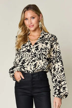 Black and cream patterned double take blouse with ruffle trim balloon long sleeves perfect for jeans size matching