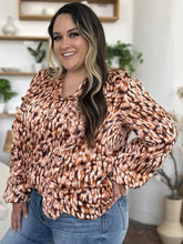 Double take full size printed ruffle trim balloon sleeve shirt with bold brown and peach leopard print and flowing silhouette