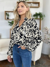 Black and white floral print blouse with long ruffle trim balloon sleeves and v neckline suitable for jeans size selection