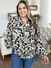 Black and cream floral print blouse with ruffled balloon sleeves ideal for casual wear with jeans size options