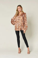 Double Take full size printed ruffle trim balloon sleeve blouse with brown and beige leopard print pattern