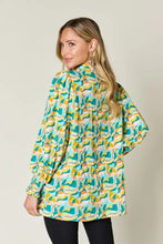 Double take full size printed smocked long sleeve blouse with bold abstract wave pattern in teal yellow and cream tones