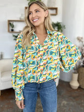Vibrant double take full size printed smocked blouse with flowing long sleeves and a relaxed fit in abstract pattern