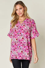 Double Take full size printed v-neck short sleeve blouse in vibrant pink and red floral pattern with flutter sleeves