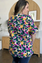 Vibrant double take full size printed v-neck short sleeve top with bold green pink purple floral pattern for jeans size