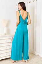 Vibrant teal spaghetti strap tied jumpsuit back view, machine wash cold