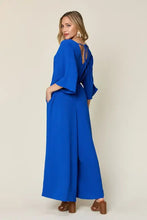 Vibrant royal blue surplice wide leg jumpsuit with flutter sleeves