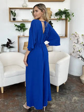 Royal blue surplice wide leg jumpsuit with back tie and pockets