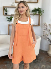 Bright orange textured Double Take romper with pockets, machine wash