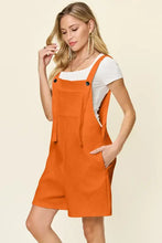 Double Take Texture Sleeveless Romper in orange fabric, machine wash