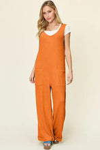 Orange ribbed Double Take jumpsuit with white top, professionally dry clean