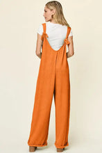 Orange ribbed Double Take jumpsuit back, professionally dry clean