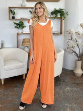 Orange ribbed Double Take jumpsuit with white top, professionally dry clean