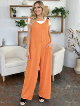 Orange ribbed Double Take jumpsuit with white top, professionally dry clean