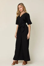 Black wrap maxi dress with flutter sleeves, tied waistband, machine wash cold