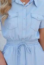 Light blue short sleeve denim dress with drawstring waist and two front pockets in denim material
