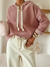A dusty rose knit drawstring dropped shoulder hoodie with lace-trimmed strings and rolled cuffs, machine wash care