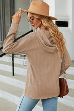 Beige textured long sleeve hoodie with drawstring half button