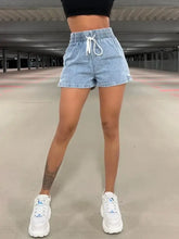 Drawstring high waist denim shorts with light wash and ruched elastic waistband