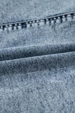 Light blue acid wash denim mini skirt with drawstring high waist and pockets