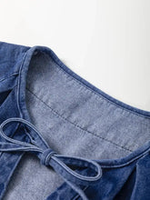 Blue denim mini dress with high waist and drawstring puff sleeves featuring a tied bow neckline detail