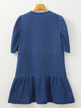 Navy blue denim mini dress with drawstring high waist, puffed sleeves, and a tiered hemline