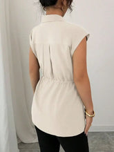 Beige sleeveless blouse with collar and gathered waistband featuring a drawstring waist cap for adjustable fit