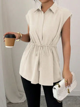 Beige sleeveless button-up blouse with drawstring waist and relaxed fit featuring waist cap sleeve design
