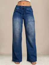 Blue denim drawstring waist wide leg jeans with front pockets and comfortable drawstring waistband