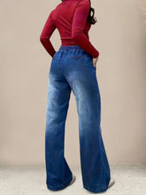 Blue denim drawstring waist wide leg jeans with high-waisted elastic waistband and subtle fading