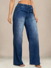 Blue denim drawstring waist wide leg jeans with elastic waistband and adjustable drawstring for comfortable fit
