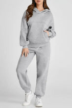 Light gray dropped shoulder long sleeve hoodie and pants set with white sneakers
