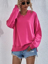 Hot pink dropped shoulder slit hoodie with long sleeve length and denim shorts