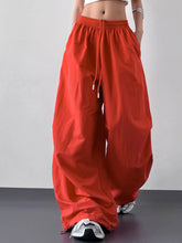 Bright red wide leg drawstring pants with elastic waistband and loose fit for comfortable everyday wear