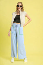 Light blue umgee drawstring wide leg pants with scallop trim detail and teal trim on pockets and waistband