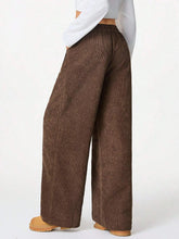 Brown corduroy high-waisted wide leg drawstring pants with a relaxed fit ideal for casual wear
