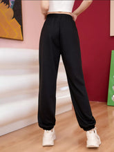 Black loose-fitting butterfly casual sweatpants with elastic cuffs and comfortable drawstring waistband for everyday wear