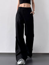 Black high waist wide leg pants with a sleek straight cut silhouette ideal for formal and casual wear