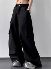Black wide leg cargo pants with multiple large pockets and a buttoned waistband in durable fabric